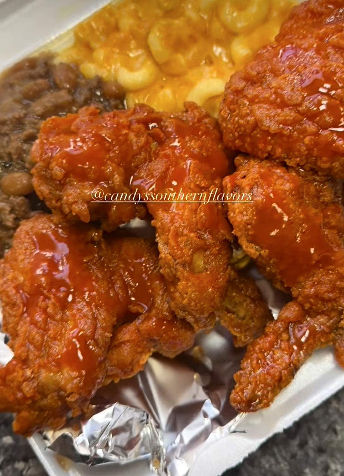 Fried chicken wings with baked mac and cheese and baked beans